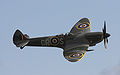 Supermarine Spitfire with 20 mm cannon protruding from the leading edge of the wing