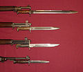 US military bayonets; from the top down, they are the M1905, the M1, M1905E1 Bowie point bayonet (a cut down version of the M1905), and the M4 Bayonet for the M1 carbine. The top 3 blades each have fullers.