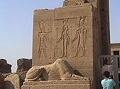 Entrance gate to the temple, with bas-relief and sphinx