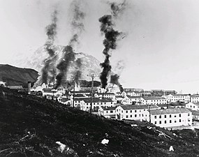 Buildings burning after the first Japanese attack, 3 June 1942.