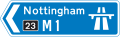 Direction to a motorway at the junction shown, indicating route number and destination reached