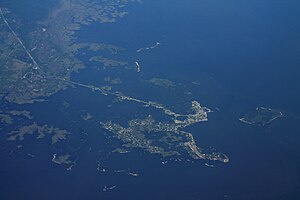 Aerial view of Cedar Key and its outlying islands, illustrating the extremely small size of the city: The fork at State Road 24 and County Road 347 (the only two access roads) can be seen in the upper left.