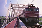 An EF81 locomotive on the Akagawa Bridge in August 2013