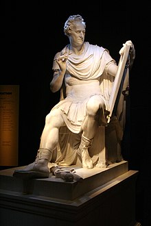 Sculpture of George Washington as classical Roman figure surrendering his sword