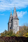 Les clochers de l'église abbatiale (1880 et 1881 tour sud et 1880, 1890 et 1891 tour nord)[25].