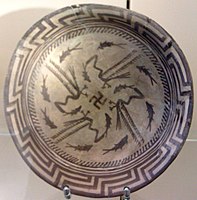 The Samarra bowl, from Iraq, circa 4,000 BCE, held at the Pergamonmuseum, Berlin. The swastika in the centre of the design is a reconstruction.[86]