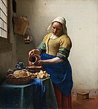 The Milkmaid by Johannes Vermeer (c. 1658). Vermeer was lavish in his choice of expensive pigments, including lead-tin yellow, natural ultramarine, and madder lake, as shown in the vibrant painting.[19]