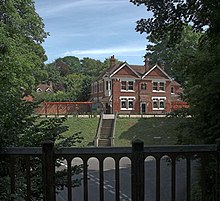 Two-story building on a hill.