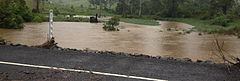 In February, when the flooding resumed, the water level of Coles Creek nearly reached the water level of Maguires Lane, Cooran.