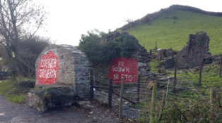 Cofiwch Dryweryn wall from the north after rebuild, October 2020, showing more of building structure after vegetation cleared