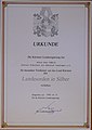 1983.Mai.31. Urkunde. Die Kärntner Landesregierung verleiht Hans Pawlik, 3. Präsident des Kärntner Landtages a. D., den „Kärntner Landesorden in Silber“.