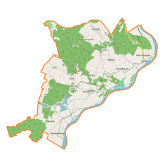 Mapa konturowa gminy Janowiec, w centrum znajduje się ikonka zamku z wieżą z opisem „Zamek w Janowcu”