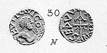 Photographie en noir et blanc d'une monnaie ancienne, pile et face.
