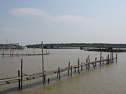 Fishing village of Kukup, with Pulau Kukup in the background.