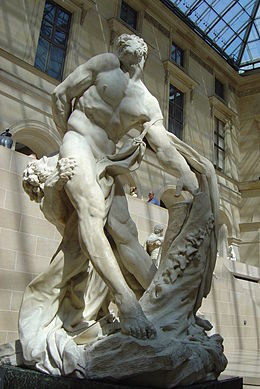 Statue de marbre d'un homme barbu attaqué par un lion.