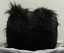 Black muff with fur trim