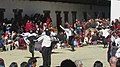 School students dancing the Black-necked Crane dance at the courtyard of Gangteng Monastery