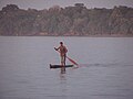 A canoeist off the west side of Fenualoa at sunset.