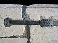 Punched lead cast in a Venice bridge wall fixing the hard-metal connecting bar