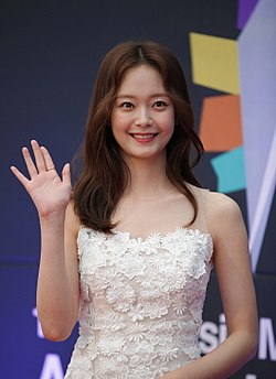 Jeon So-min in white dress wearing for the camera in 2017