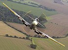 Eine Spitfire über RAF Coningsby – Finalist (Platz 12) beim Wettbewerb um das Bild des Jahres 2015. KW 25 (ab 19. Juni 2016)