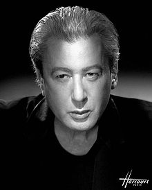 black-and-white close-up of Alain Bashung wearing a dark shirt, looking intently just right of camera
