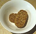 Two Weetabix in a bowl before milk is added