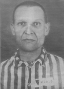 Auschwitz detainee Ignacy Kwarta wears a red P-triangle, meaning a Polish political enemy