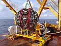 Image of the KM3NeT LOM (Launcher of Optical Modules) with a string coiled in, on the ship's deck, prior to deployment.