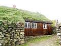 Old stone and wooden houses with turf roof in Koltur
