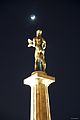 Statue of the Victor at night with the Moon and Ursa Minor seen in the background.