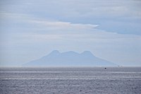 Silhouette of Mt. Timpoong (L) and Mt. Mambajao (R), the highest peaks of the largest mountain in Camiguin, as seen from the north, across Bohol Sea