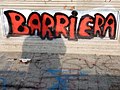Scritta sui muri del quartiere in via Bologna