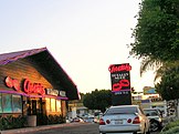 Exterior photograph of a strip club advertising full nude entertainment (Cheetah's, in San Diego, California
