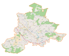 Mapa konturowa powiatu jarosławskiego, blisko centrum na dole znajduje się punkt z opisem „Radymno”
