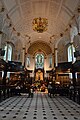 Inside St Clements Danes church; the black spots on the floor are the badges