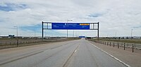 Terminal East gantry sign at Denver International Airport (DIA) with an empty freeway during the pandemic.