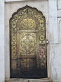 Bronze main door with floral decoration