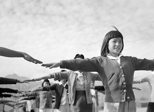 Internees practicing calisthenics at Manzanar War Relocation Center