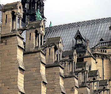 The massive buttresses which counter the outward thrust from the rib vaults of the nave. The weight of the building-shaped pinnacles helps keep the line of thrust safely within the buttresses.