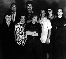 Oingo Boingo in 1987. From left to right: Dale Turner, Sam "Sluggo" Phipps, John Avila, Steve Bartek, Danny Elfman, Johnny "Vatos" Hernandez, Mike Bacich, Leon Schneiderman.