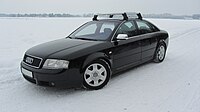 Audi S6 mit Original-16-Zoll-Winter-Aluminium-Gussrädern mit 6-Speichen und Original-Dachgrundträger logo