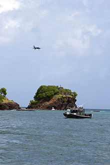 A Regional Security System aircraft approaches Tapion Rock in Castries, St 130529-N-HP195-365.jpg