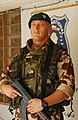 Slovak soldier stands guard in front of the Multinational Division-Central South headquarters at Camp Echo, Iraq, 2006