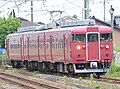 Set B04 in JR-West all-over crimson Nanao Line livery in June 2015