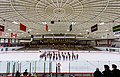 The Brown University Band performs on the ice after a game