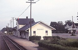 Top: Lee Hall Depot, painted a faded yellow with dark roof