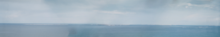 Панорама островів Хабомай. Вид з "Вежі Миру" на Хоккайдо, півострів Немуро (мис Носаппу) 26 березня 2005 року.