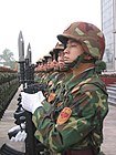 Chinese soldier with QBZ-95 rifle and multi-purpose knife bayonet.