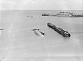 Darwin Harbour with the sunken ship MV Neptuna and burnt-out wharf of Naval Base Darwin following the attack on February 19, 1942